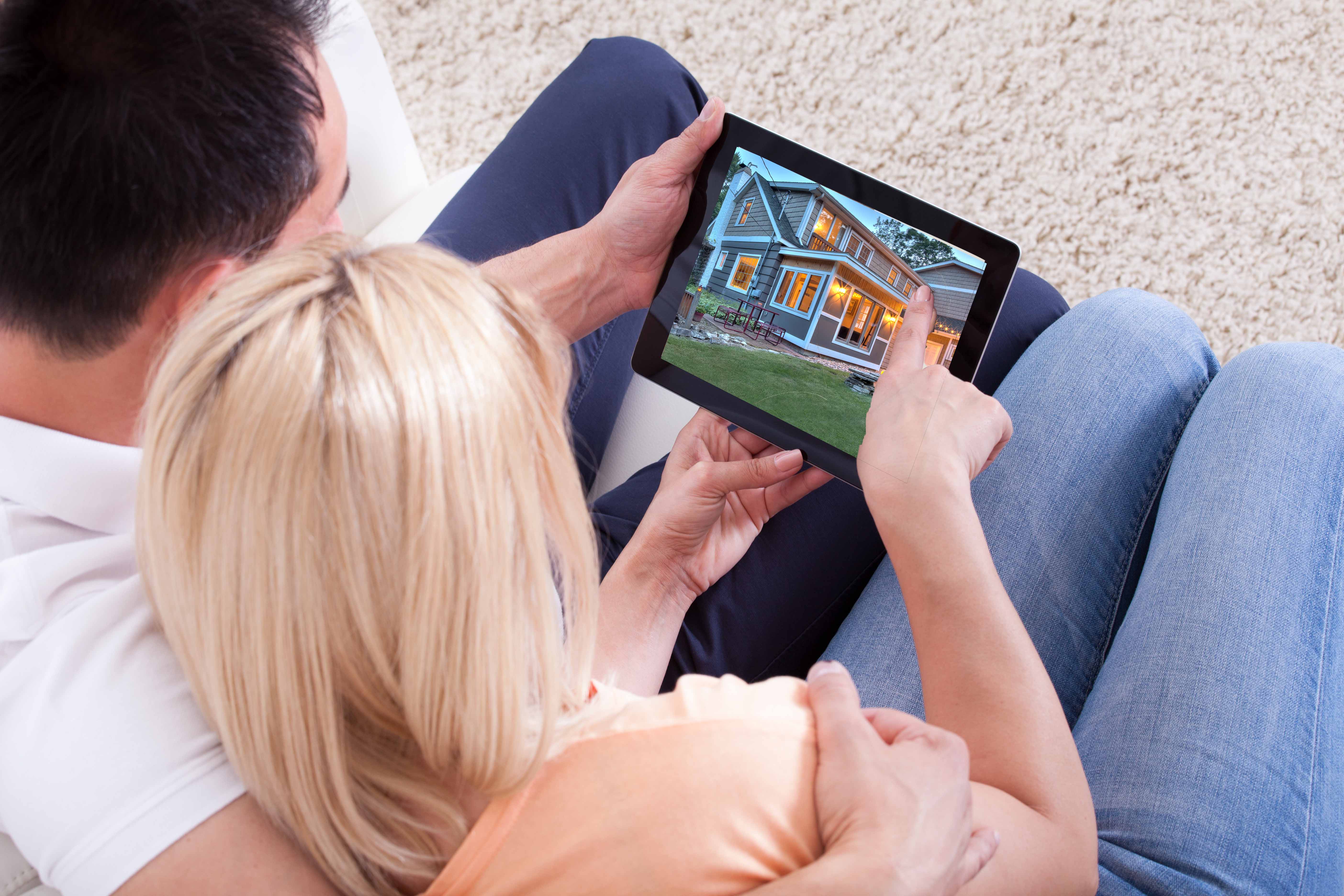 Couple Looking At Digital Tablet