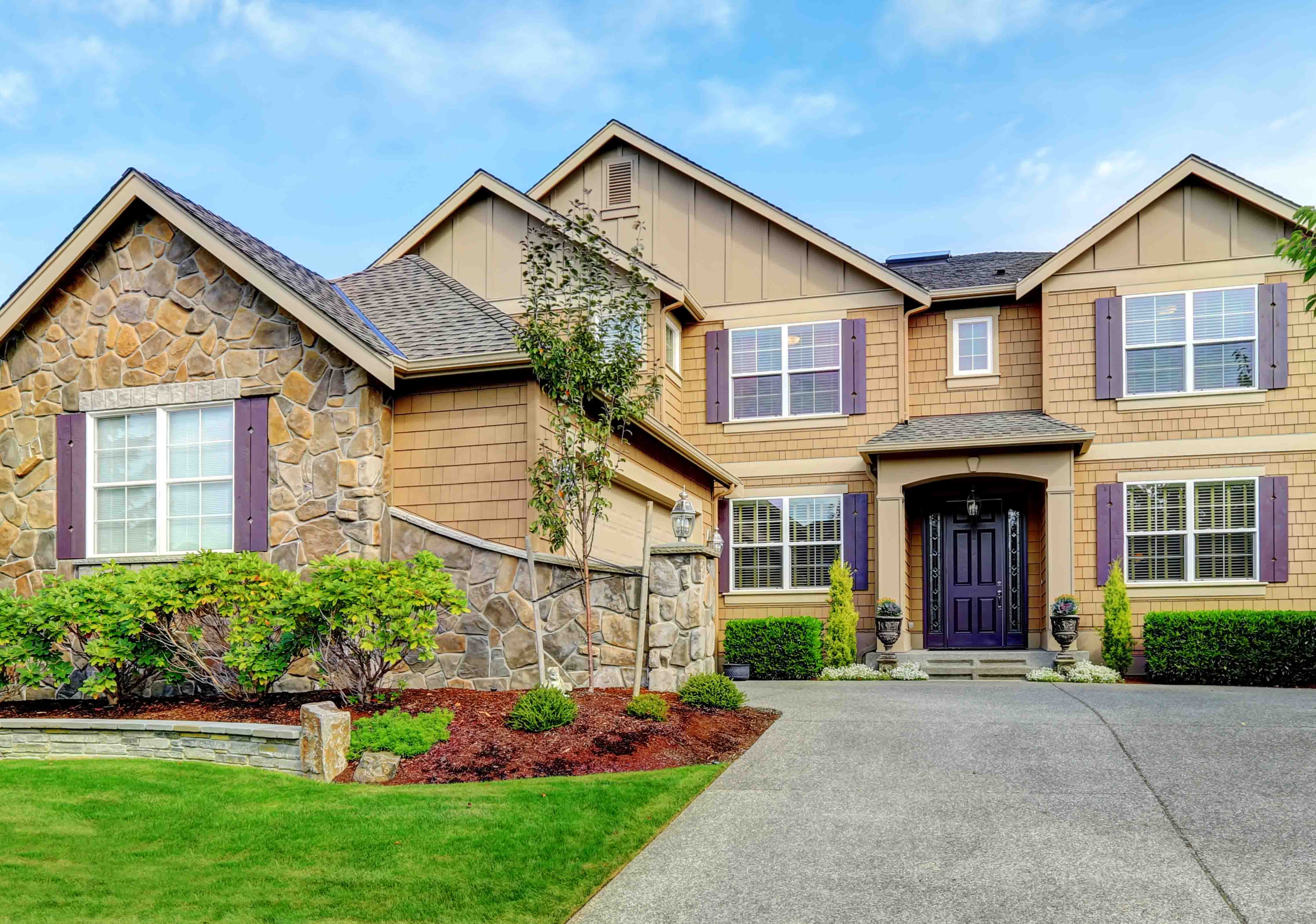 luxury home with stone accents